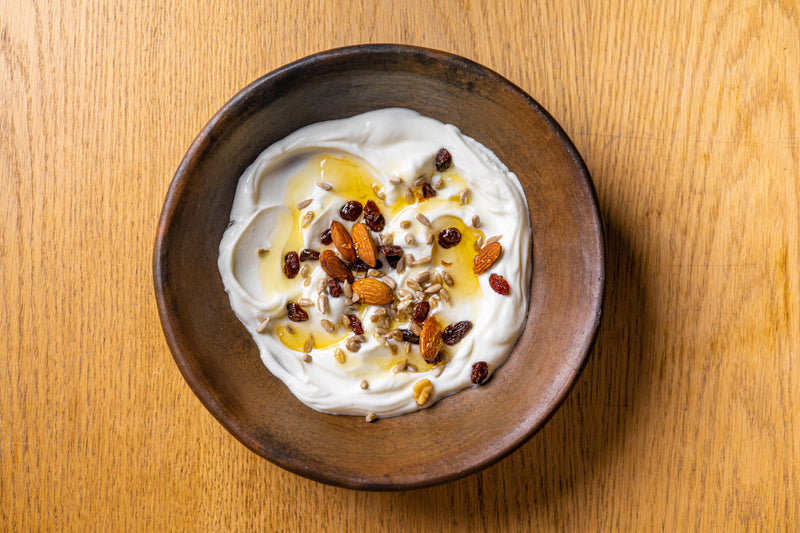 A close-up of a delicious recipe prepared with argan oil, showcasing vibrant ingredients and the rich, golden oil drizzled over the dish, adding a Moroccan touch.