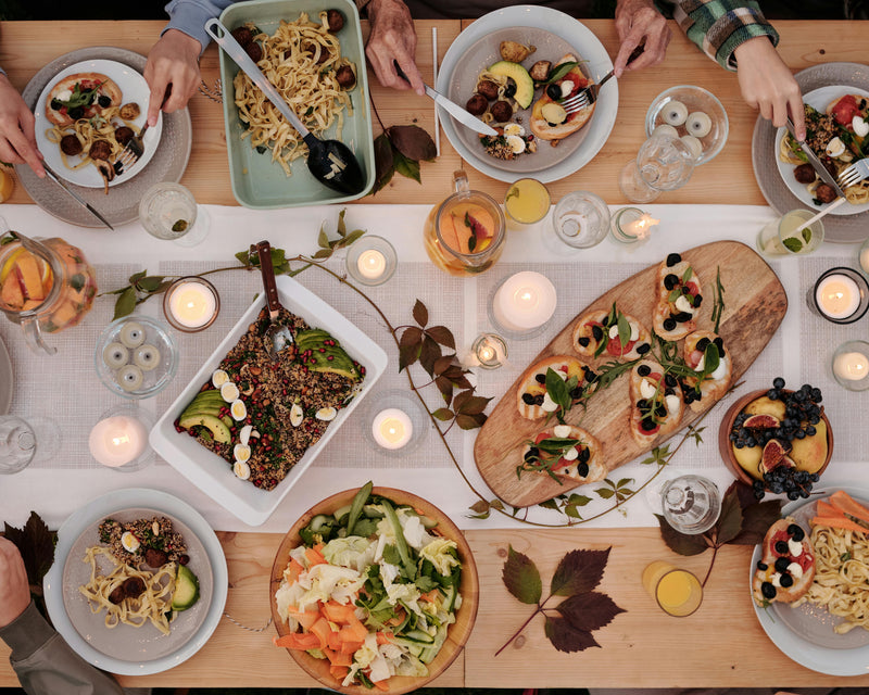 A warm family meal featuring dishes drizzled with pure argan oil, adding an authentic Moroccan touch to every bite.
