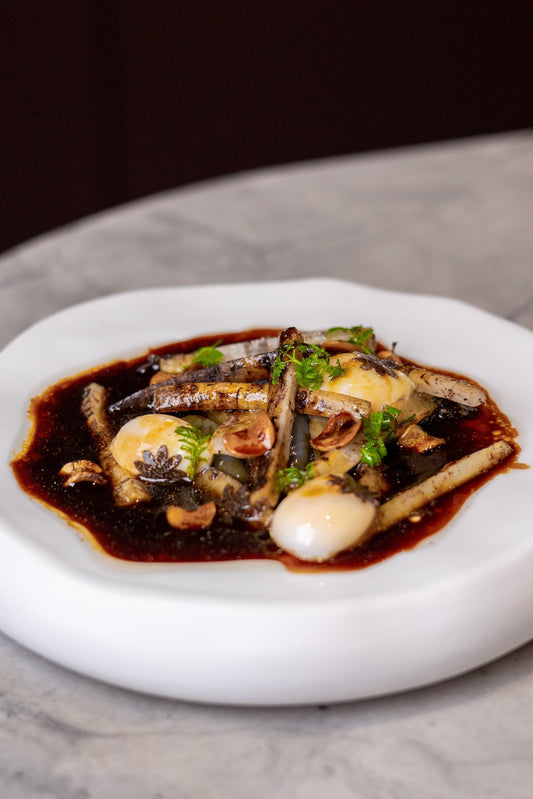 Quail Eggs, Black Truffles, and Roasted Salsify with Argan Oil Sauce