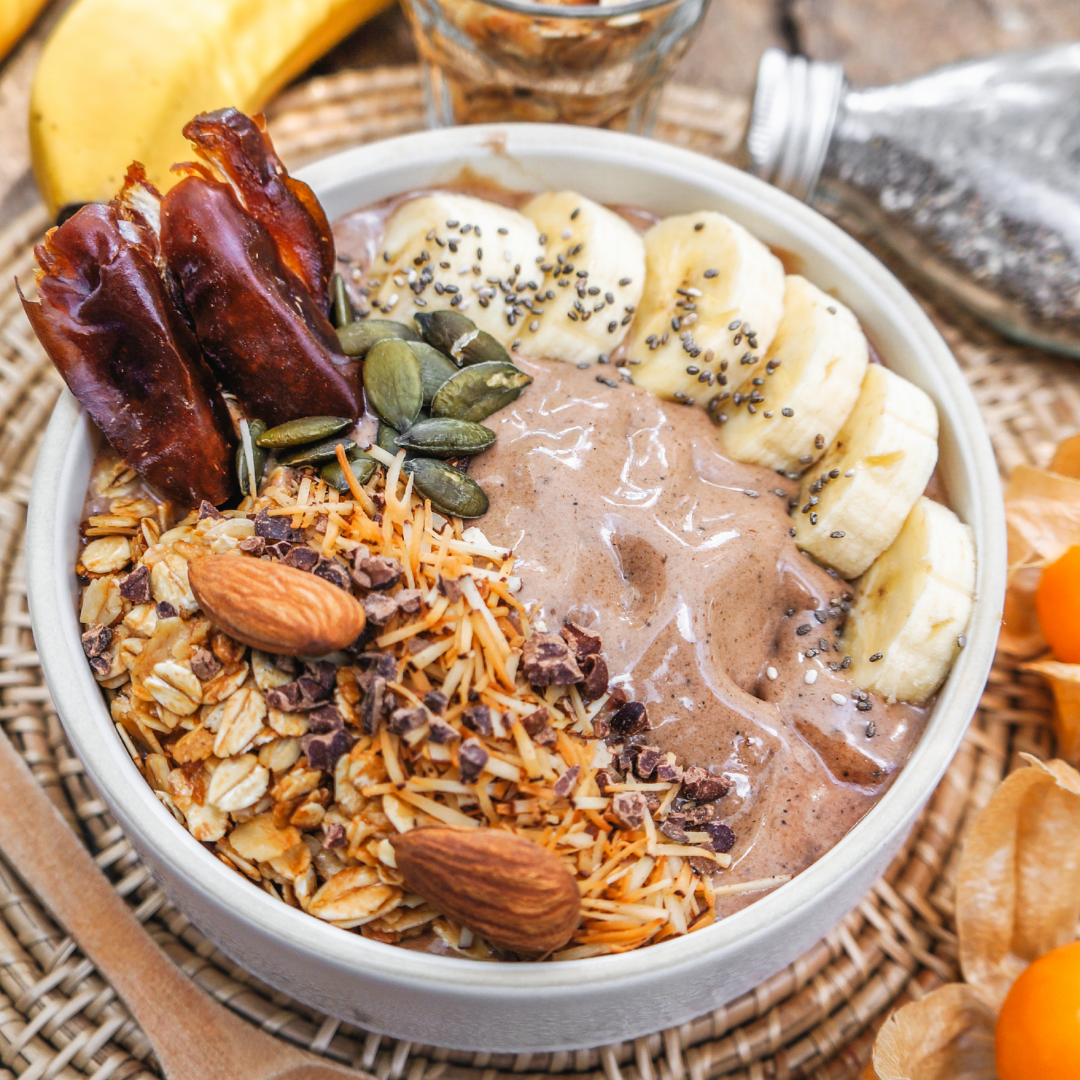 Autumn smoothie bowl with banana, dates, and culinary argan oil