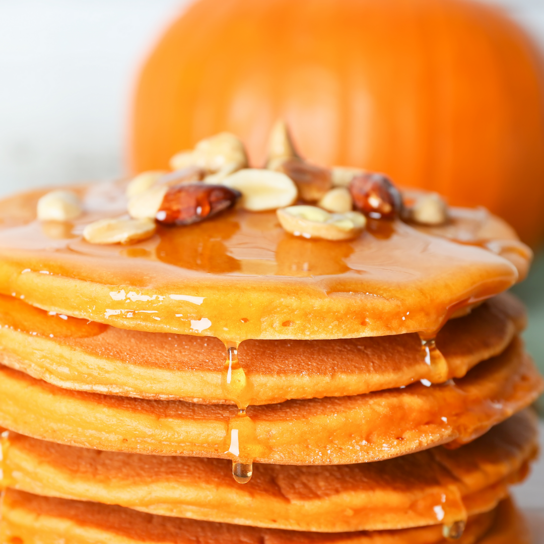 Drizzling culinary argan oil on pumpkin spice pancakes
