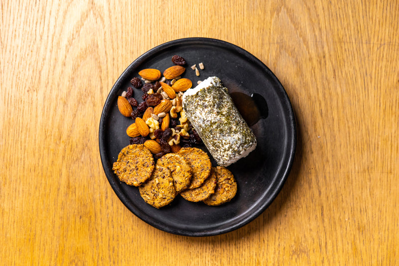 A close-up of a delicious recipe prepared with argan oil, showcasing vibrant ingredients and the rich, golden oil drizzled over the dish, adding a Moroccan touch.