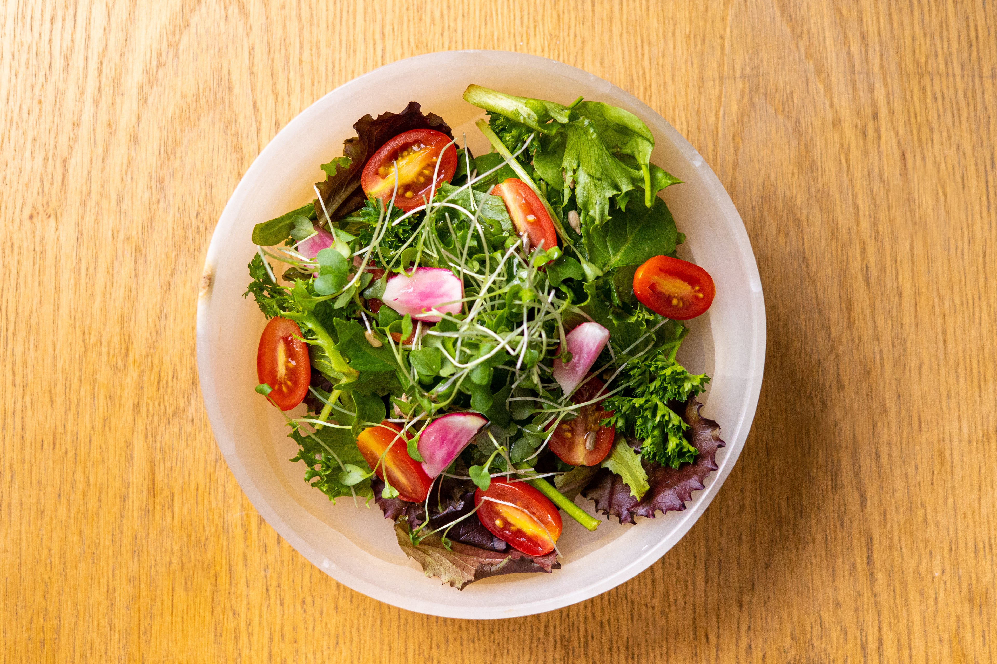 A close-up of a delicious recipe prepared with argan oil, showcasing vibrant ingredients and the rich, golden oil drizzled over the dish, adding a Moroccan touch.