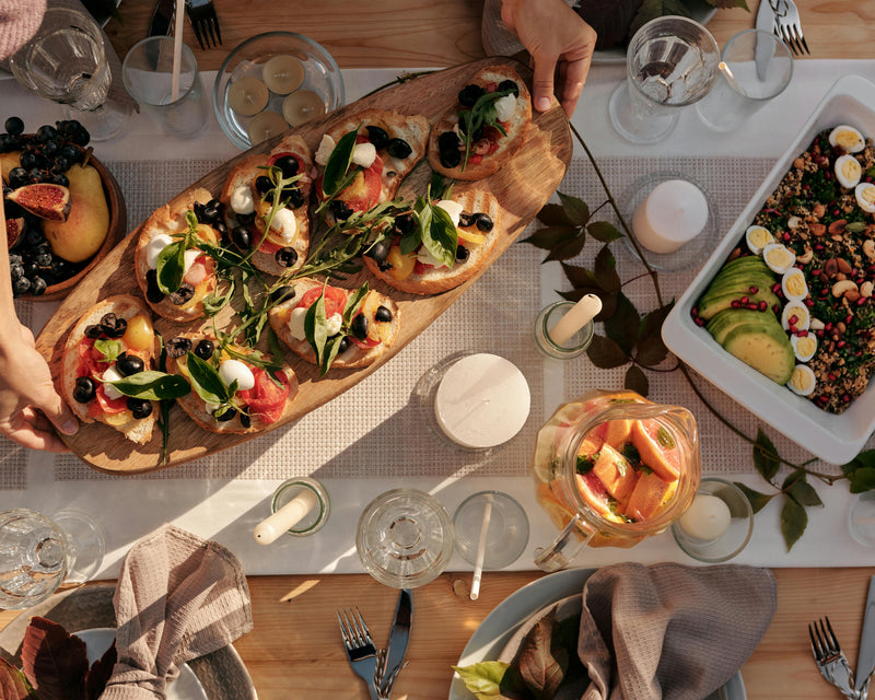 A family enjoying a delicious meal, featuring dishes drizzled with high-quality argan oil, enhancing the flavors with a touch of Moroccan tradition.